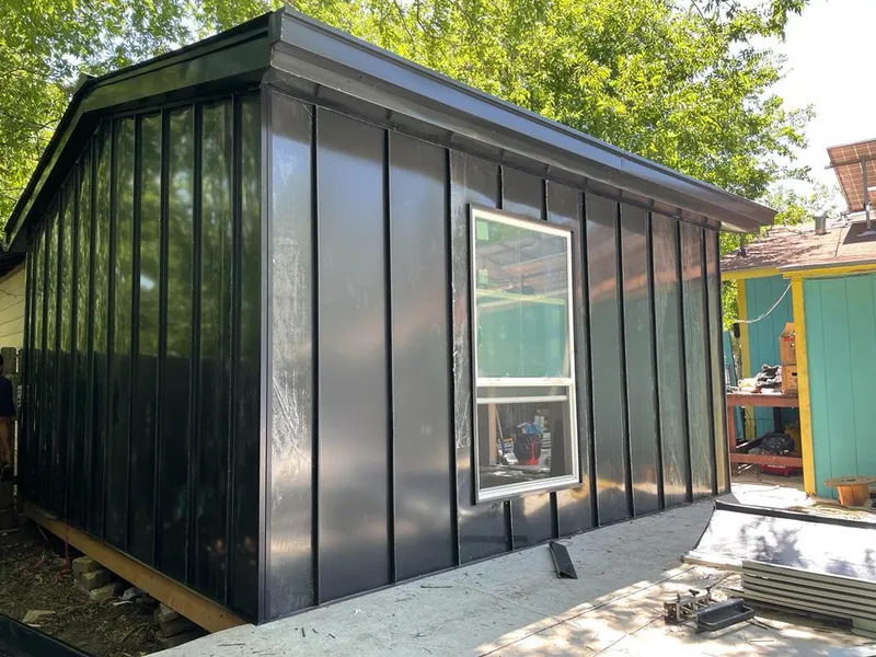 Black standing seam metal wall panels for Roof Inspection in Kendall West