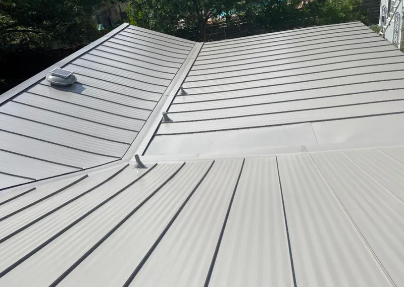 Solar attic fan installed on a metal roof for Roof Ventilation in Kendall West